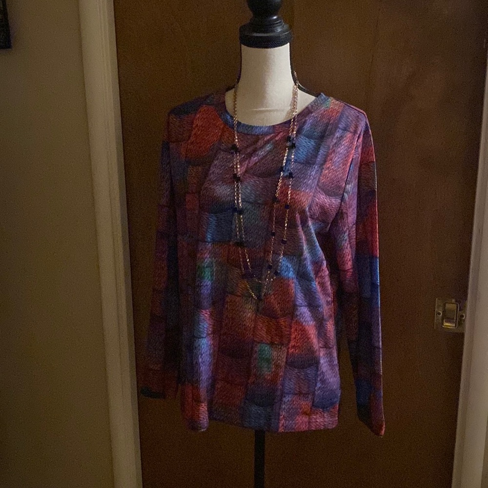 A fall long sleeve blouse that looks like it’s patch work done